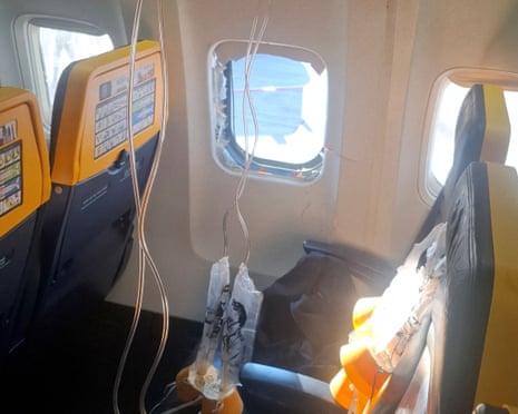 The broken window and interior of the Ryanair aircraft in a picture obtained from social media