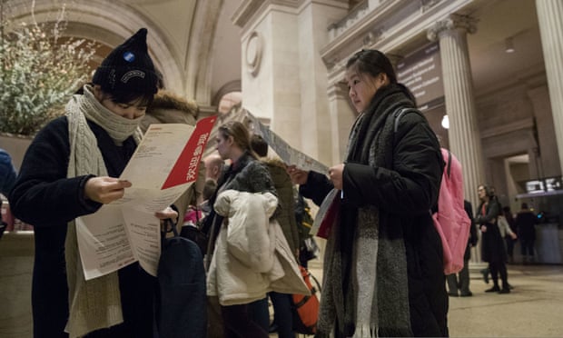 Visitors to the Metropolitan Museum of Art inspect the map of the museum after purchasing a ticket, Thursday, Jan. 4, 2018, in New York. Starting March 1, the museum will charge a mandatory $25 entrance fee to most adult visitors who don’t live in New York state, the Met’s president and CEO, Daniel Weiss, announced Thursday. Admission will still be pay-what-you-wish for New Yorkers. (AP Photo/Mary Altaffer)