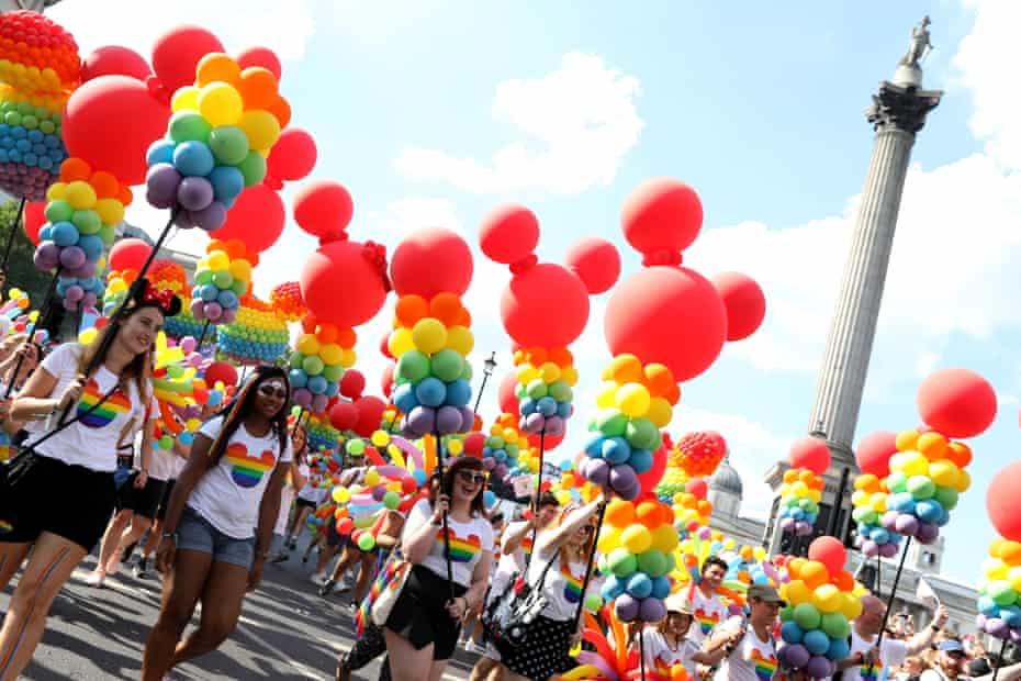 People take part in the Pride in London march in 2018