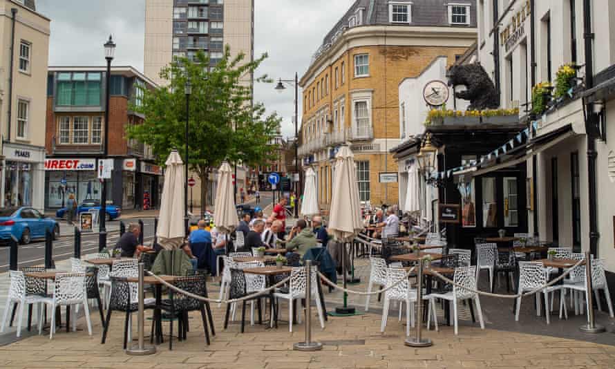 People sit outside a pub