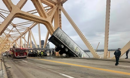 The truck hanging over the edge of the Clark Memorial Bridge over the Ohio River