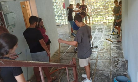 Arabs and Jews cleaning up public bomb shelters in Haifa