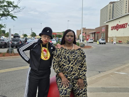 two women stand outside target store