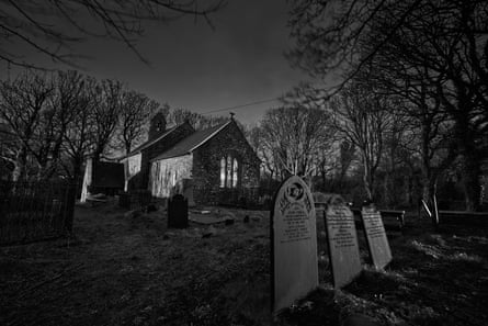 Graveyard and church at night-time