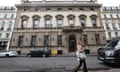 A person walks past the entrance to the Garrick Club in London.