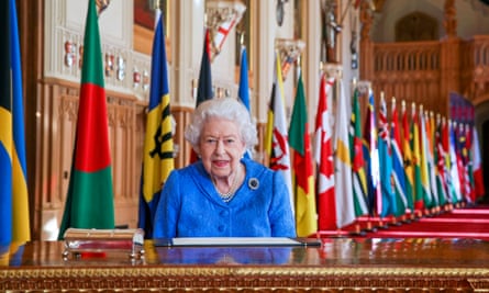 Queen Elizabeth signs her annual Commonwealth Day message in St George’s Hall at Windsor Castle.