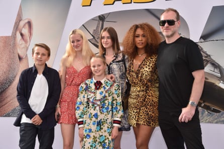 Eve with husband Maximillion Cooper and his children.