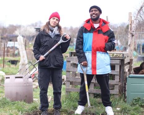 Flo Dill and Novelist holding spades on Dill's allotment