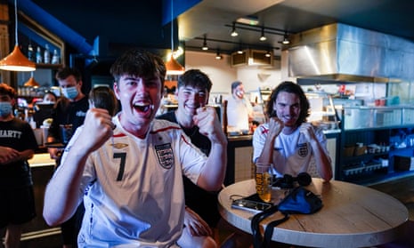 England fans in a Falmouth pub celebrate their team scoring in the first Euro 2020 match against Croatia.