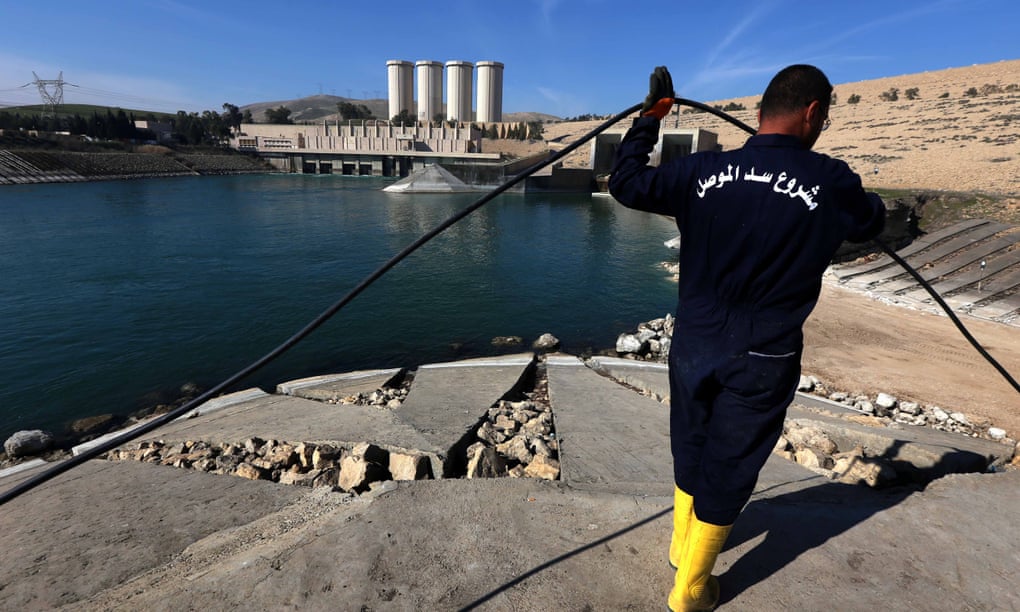 An employee works at strengthening the Mosul Dam on the Tigris River