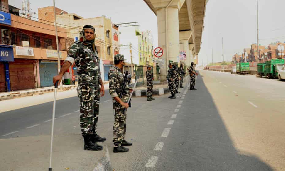 Soldiers stand guard during lockdown in Delhi, India.