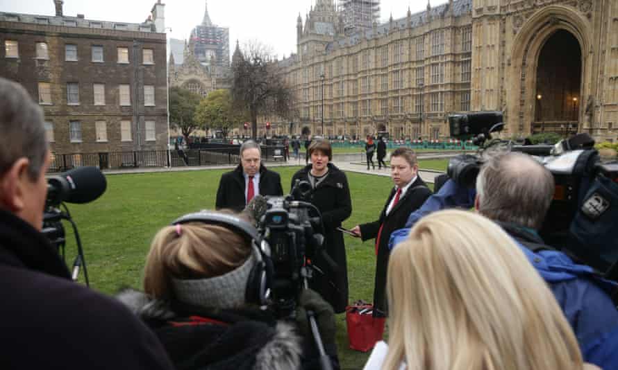 DUP leader Arlene Foster and deputy leader Nigel Dodds speak to the media in Westminster.