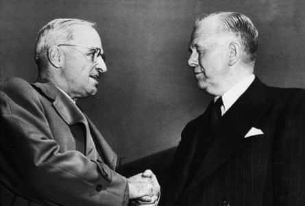 two men shake hands
