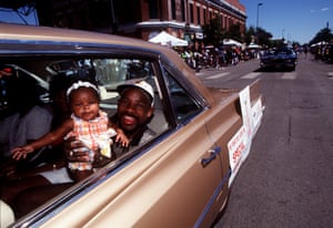 Local boxing favorite Stevie Johnson with his four-month-old daughter, Vivica, in a Juneteenth parade in Denver, Colorado, in 1998