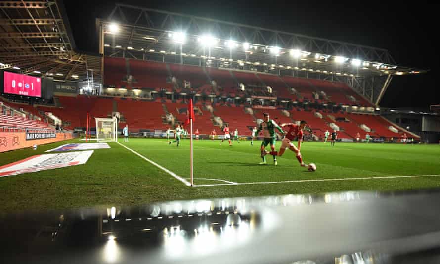 Bristol City’s Callum O’Dowda (right) is tackled by Millwall’s Jed Wallace at a wet Ashton Gate on Tuesday night.