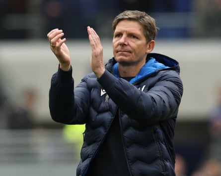 Oliver Glasner applauds fans on the pitch