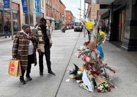 Flowers outside the department store on Henry Street, Dublin, where Yves Sakila, was restrained and later pronounced dead.