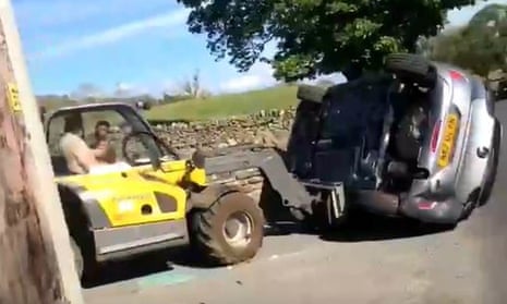 Tractor lifts car