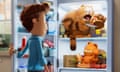 a boy opens a fridge door to see garfield and garfield's dad in it, eating pizza and hot dog