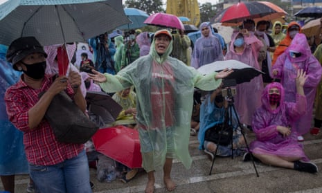 Pro-democracy students and their supporters dance to rap music during a protest rally in Bangkok on Sunday