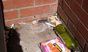 Syringes and other drug paraphernalia lie in an alley in North Richmond.
