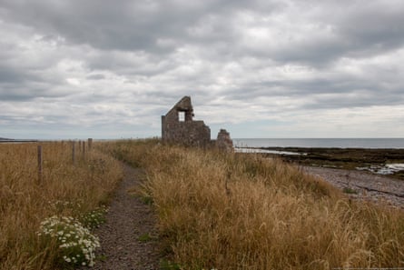The remains of the ‘lost’ village of Miltonhaven, Aberdeenshire. Partial ruins of one house very close to the sea on a cloudy day.