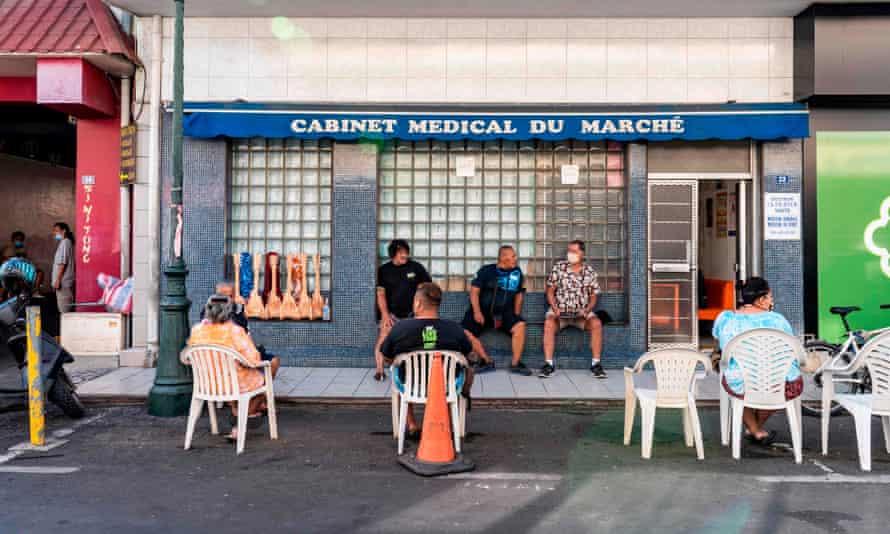 People wait at the doctor’s office near the market in Papeete, French Polynesia on 25 August 2020, amid the coronavirus pandemic.