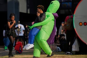 A man dressed as a ninja turtle smoking a cigarette
