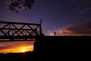 Sunrise over the Algebuckina Bridge, South Australia. The bridge spans Neales River and is the longest along the Old Ghan Railway.