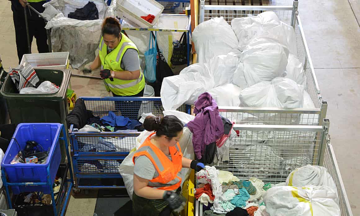Women sorting through bags of clothes