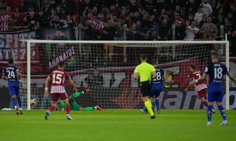 Kostas Fortounis opens the scoring for Olympiakos.