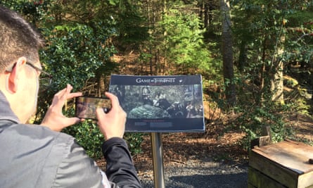 A tourist on the Game of Thrones trail in Tollymore forest in Northern Ireland.