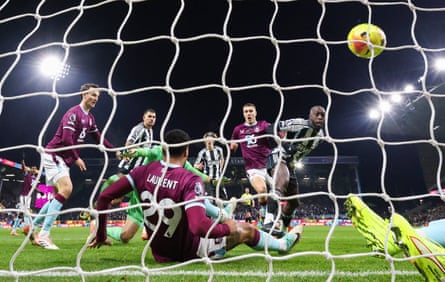 Newcastle’s Yoane Wissa scores his side’s second goal despite the attentions of Burnley’s Martin Dubravka and Maxime Esteve