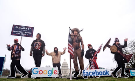 Cardboard cutouts of big tech CEOs dressed as Capitol insurrectionists are displayed outside the US Capitol in Washington.