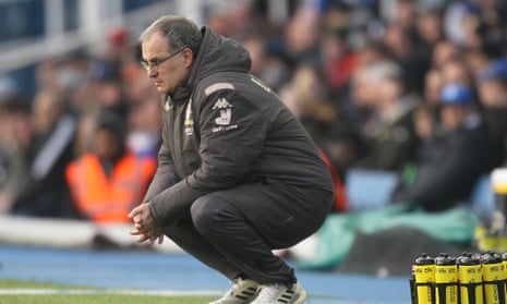 Marcelo Bielsa crouches during Leeds' dramatic win at Birmingham.
