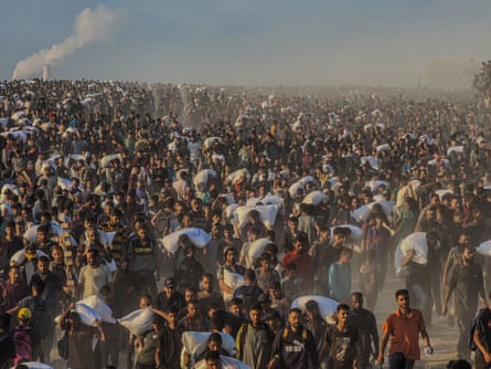 Palestinians flock to the aid centre in northern Gaza City.