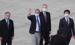 US Health Secretary Alex Azar waves to the journalists as he arrives at Sungshan Airport in Taipei on August 9, 2020.