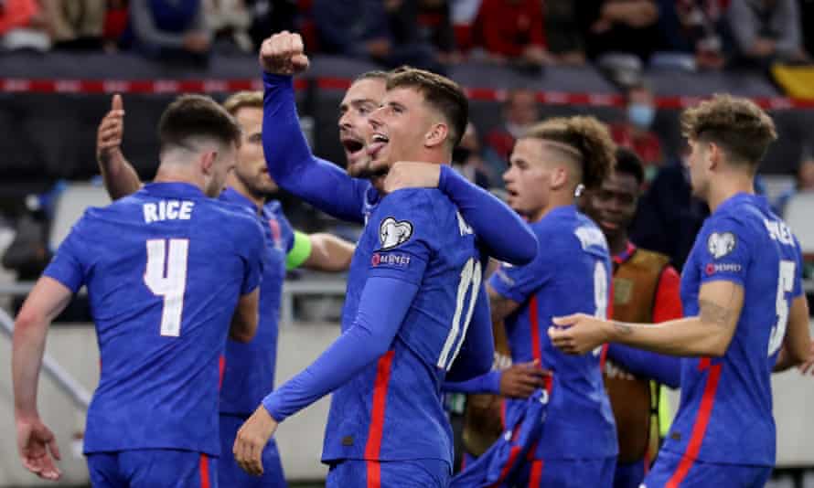 Raheem Sterling celebrates scoring their first goal with Mason Mount, Jack Grealish and teammates
