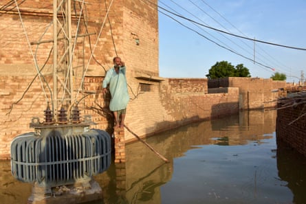 People effected by floods move to higher grounds in Dadu district, Sindh province.