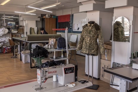 A volunteer works at a workshop for creating female military uniforms in Kyiv.