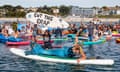 Protesters during a paddle-out in Falmouth organised by Surfers Against Sewage.