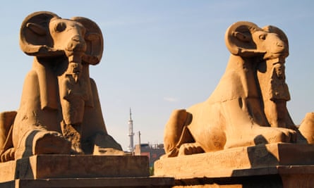 Two of the ram-headed sphinxes at the entrance of the Temple of Karnak in Luxor.