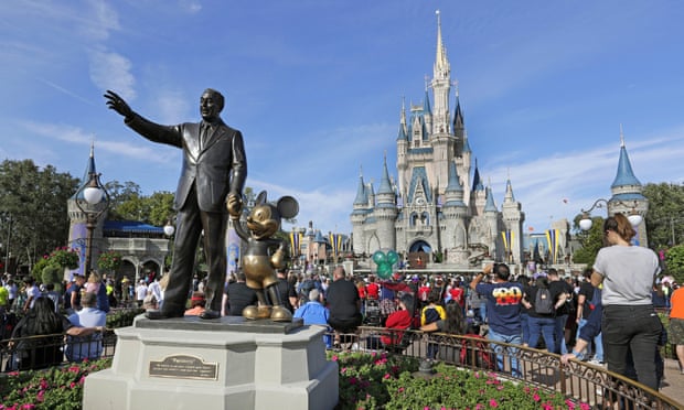A statue of Walt Disney and Mickey Mouse near the Cinderella Castle at the Magic Kingdom. 