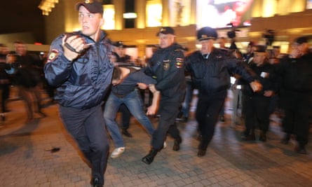 Policemen detain demonstrators in St Petersburg.
