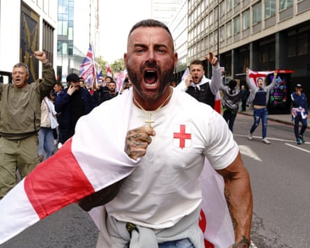A man wearing a crucifix at a far-right rally in London, 13 September 2025
