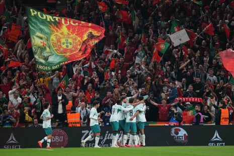 Joao Cancelo, his teammates and the Portugal fans celebrate after he opens the scoring against Denmark.