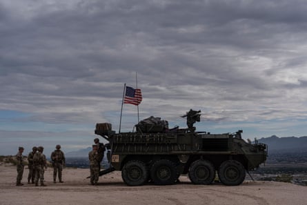 A Stryker combat vehicle sits atop a hill overlooking the US-Mexico border fence in Sunland Park, New Mexico, on 23 July 2025.