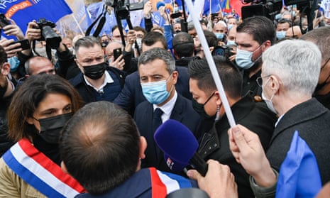 Gérard Darmanin (centre) at the protest by police in Paris on Wednesday.