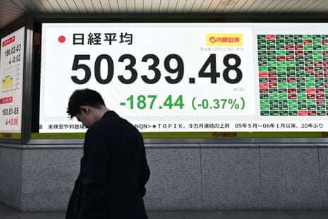 A stock market indicator board on the final trading day of the year in Tokyo, Japan, today.