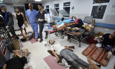 Wounded Palestinians receive treatment at al-Shifa hospital in Gaza City amid ongoing battles between Israel and Hamas.